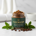 Peppermint Coffee Scrub on white marble with peppermint leaves and coffee beans